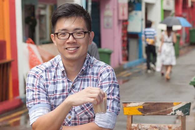 Choon Han drinking a mocha outside a cafe in Singapore