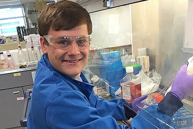 Adam Penson, employee, in a science lab