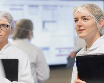 Women in hairnets in a conversation