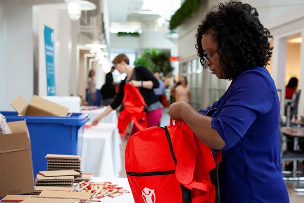 Woman packing a backpack