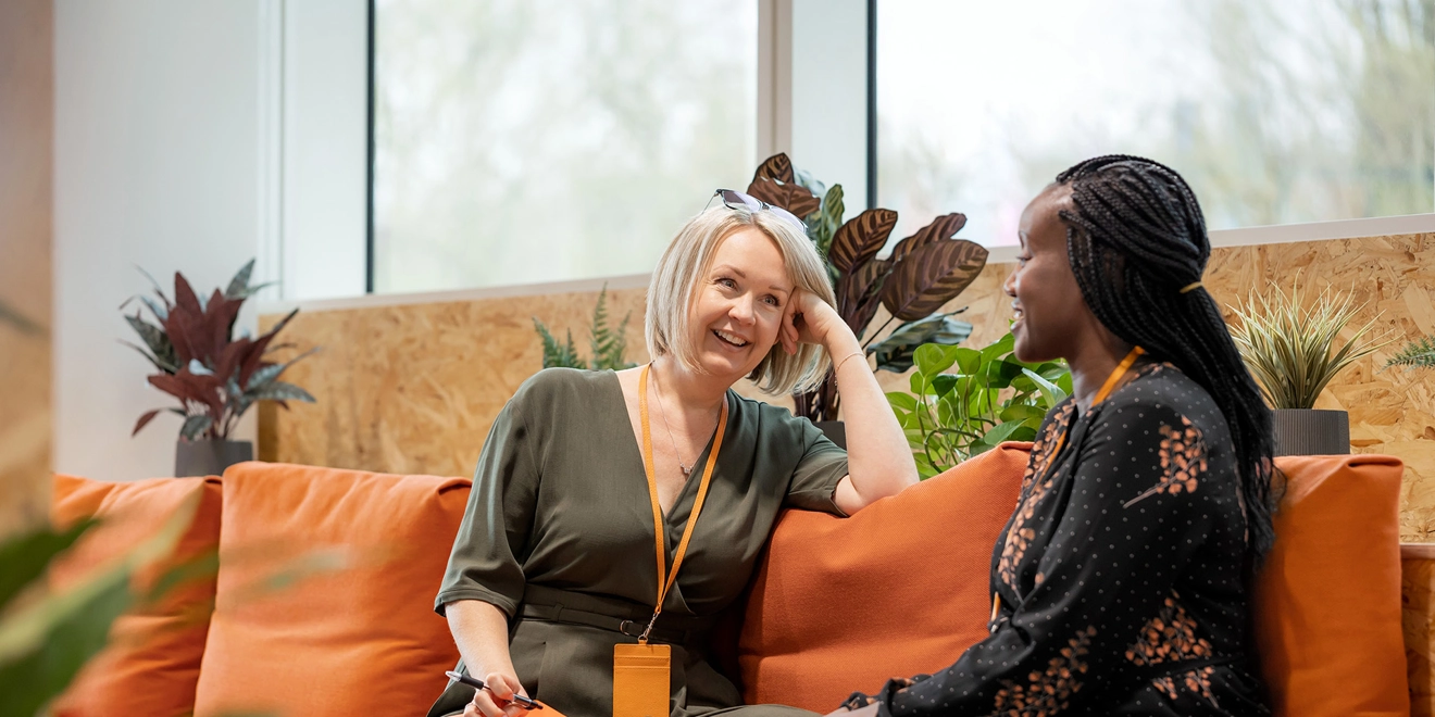 two people speaking together in an office