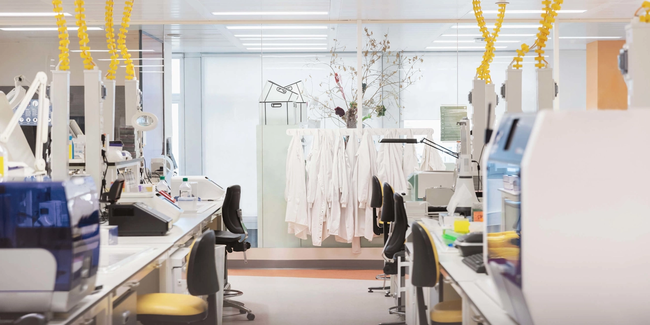 Laboratory with lab coats in the back